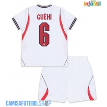 Camisa de time de futebol Inglaterra Marc Guehi #6 Replicas 1º Equipamento Infantil Mundo 2026 Manga Curta (+ Calças curtas)